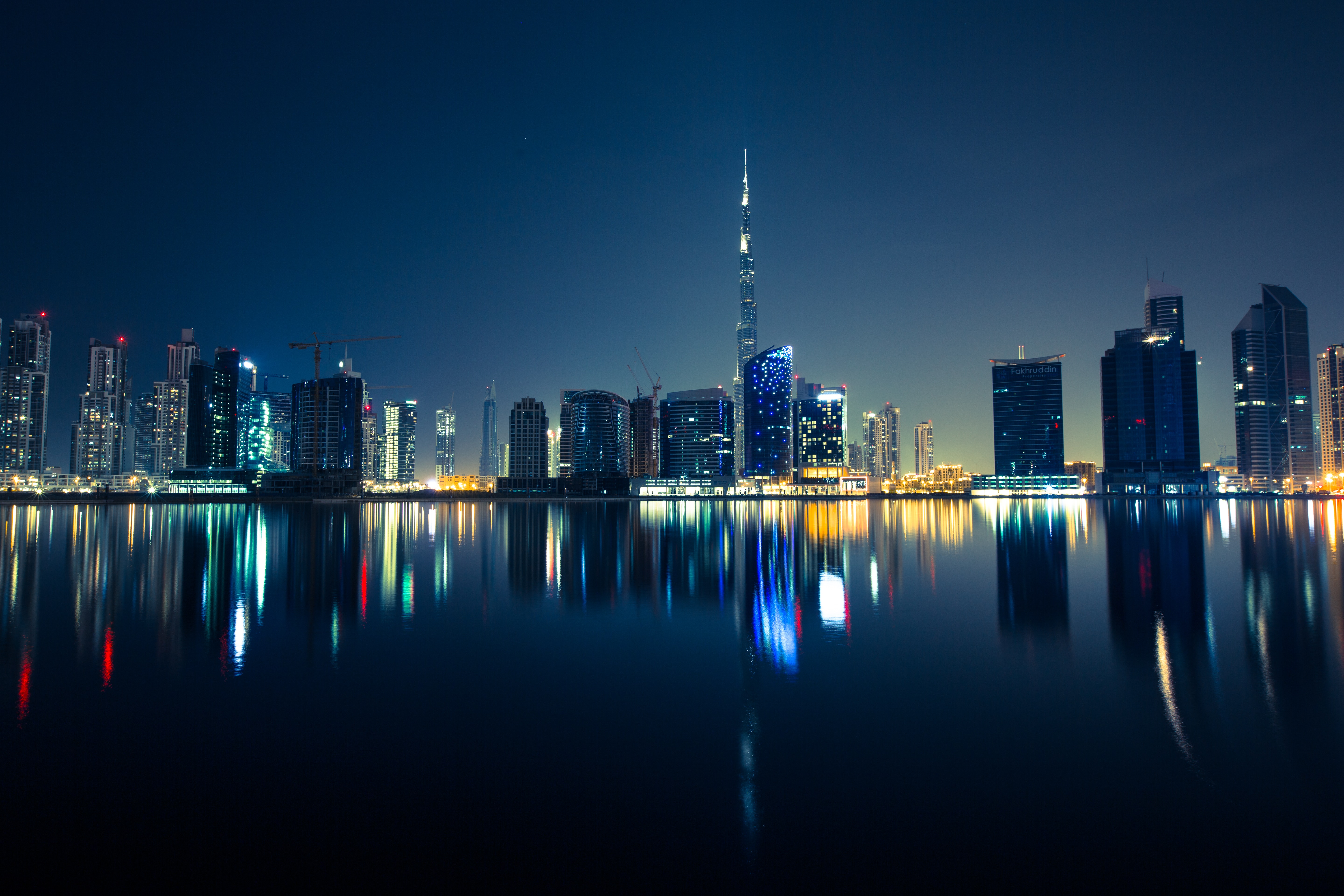 The Dubai skyline at dusk, seen across the city